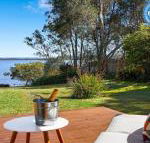 Braeside waterfront fireplace - Accommodation Daintree